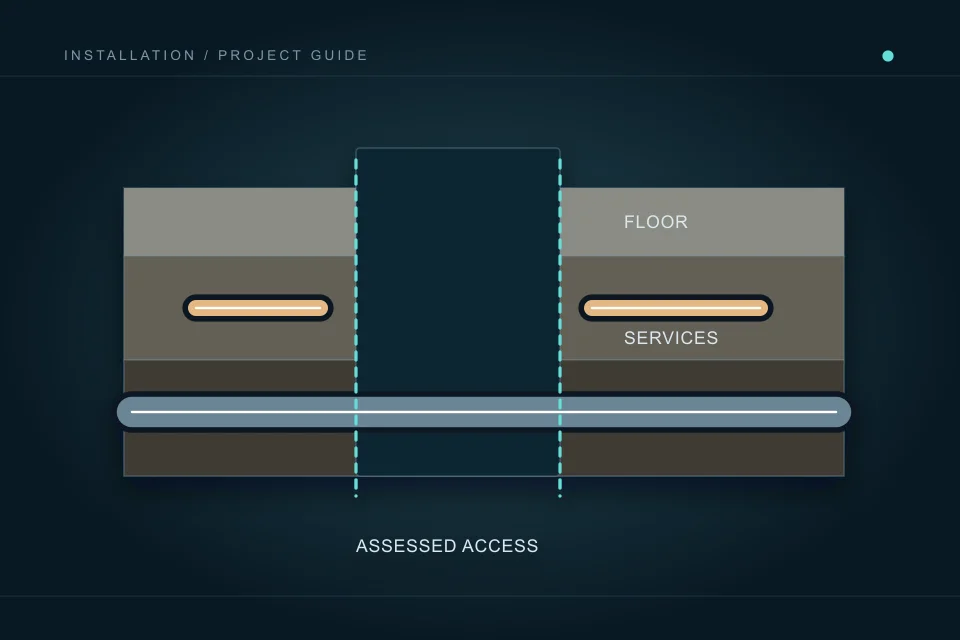A defined opening passes through floor layers while separate concealed service routes remain visible for assessment.